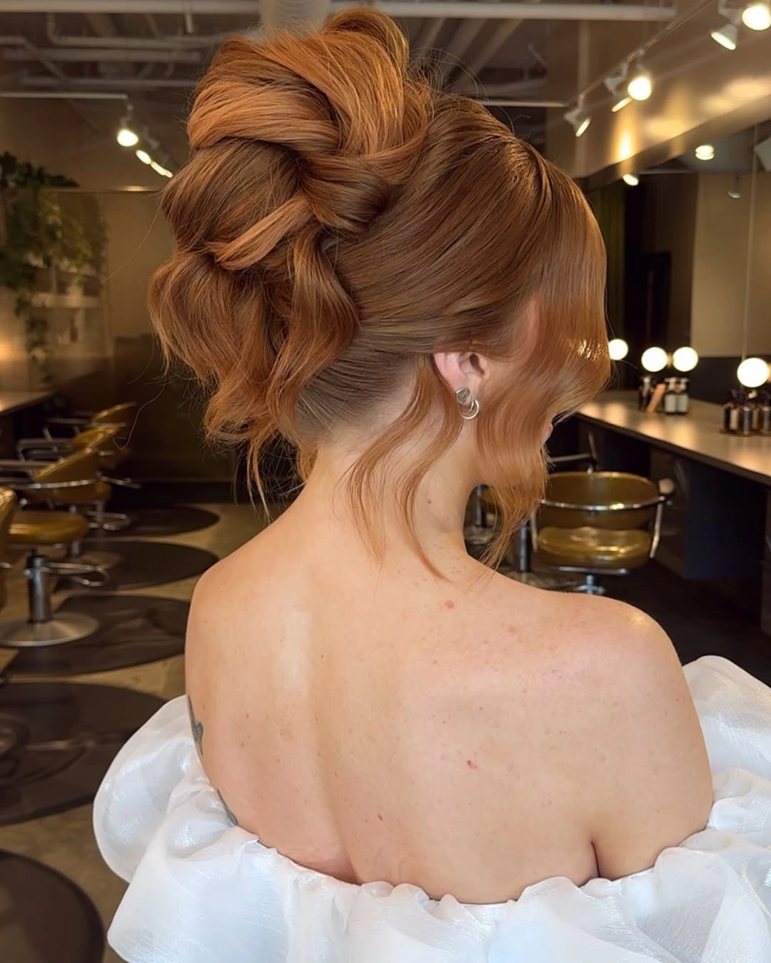 Fall hairstyles for wedding guests 2026 Textured Twisted Updo Full Of Autumn Volume