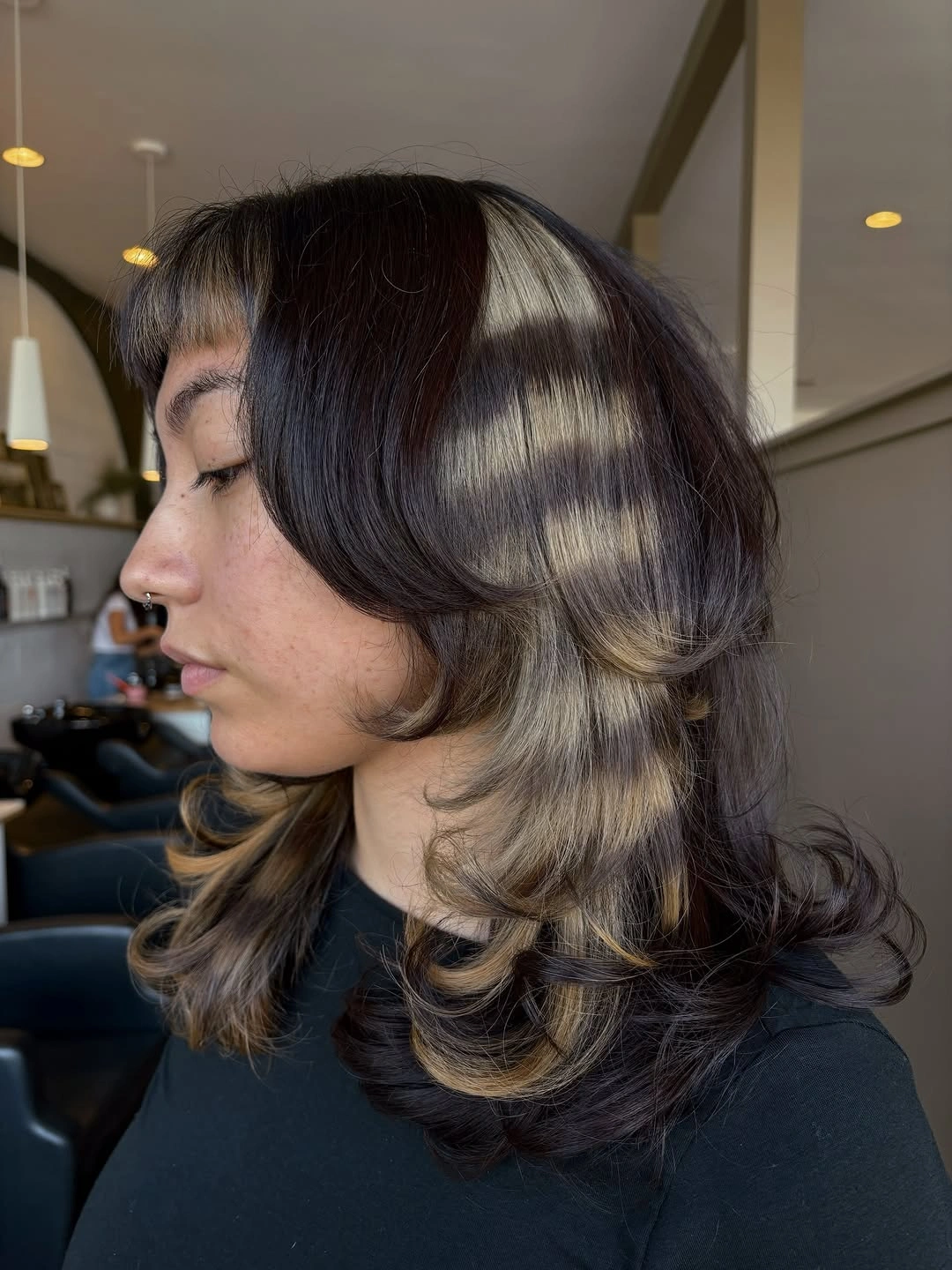 fall medium haircuts 2026 Bold Color Block Layers with Sculpted Curtain Bangs