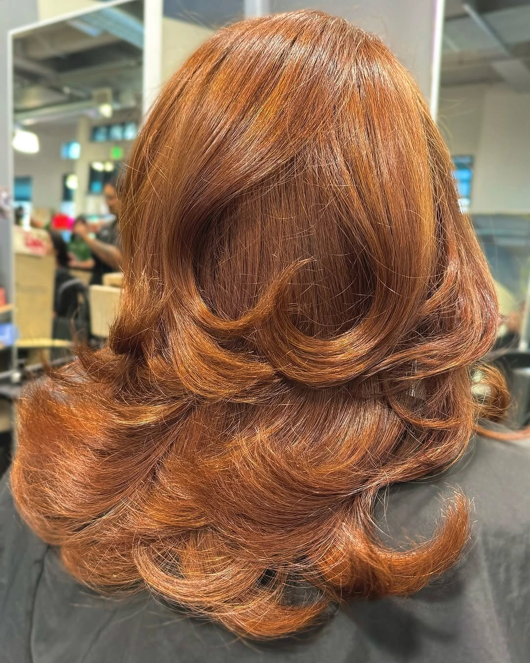 fall medium haircuts 2026 Polished Copper Flip with Vintage Volume