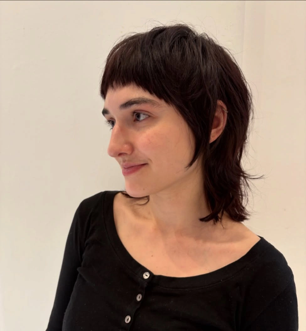 fall medium haircuts 2026 Edgy Medium Wolf Cut with Micro Bangs
