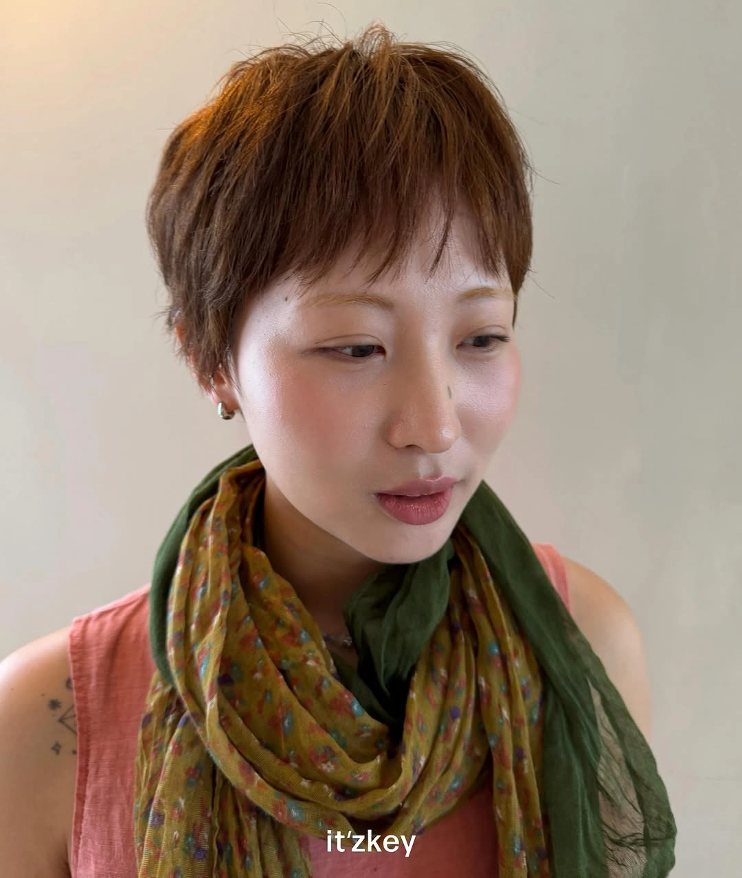 fall pixie haircut ideas 2026 Soft Feathered Pixie With Natural Warm Brown
