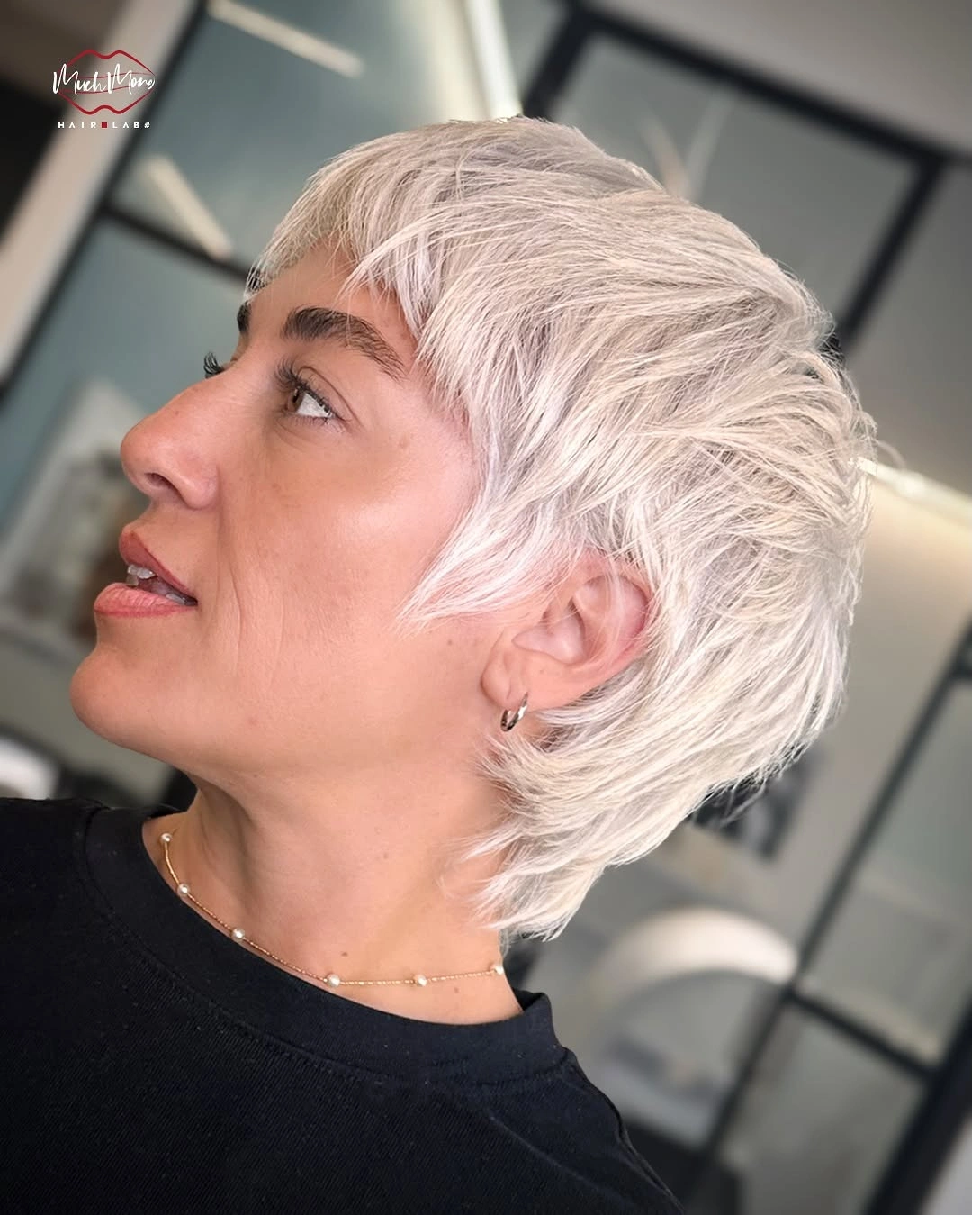 fall pixie haircut ideas 2026 Feathered Platinum Pixie With Modern Volume