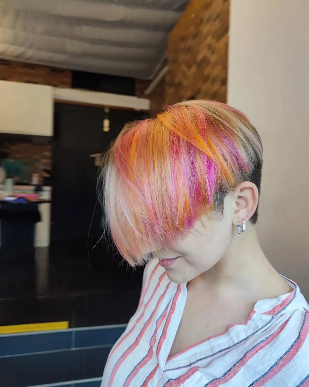 fall short haircuts 2026 Creative Pastel Undercut Bob With Sunset Highlights