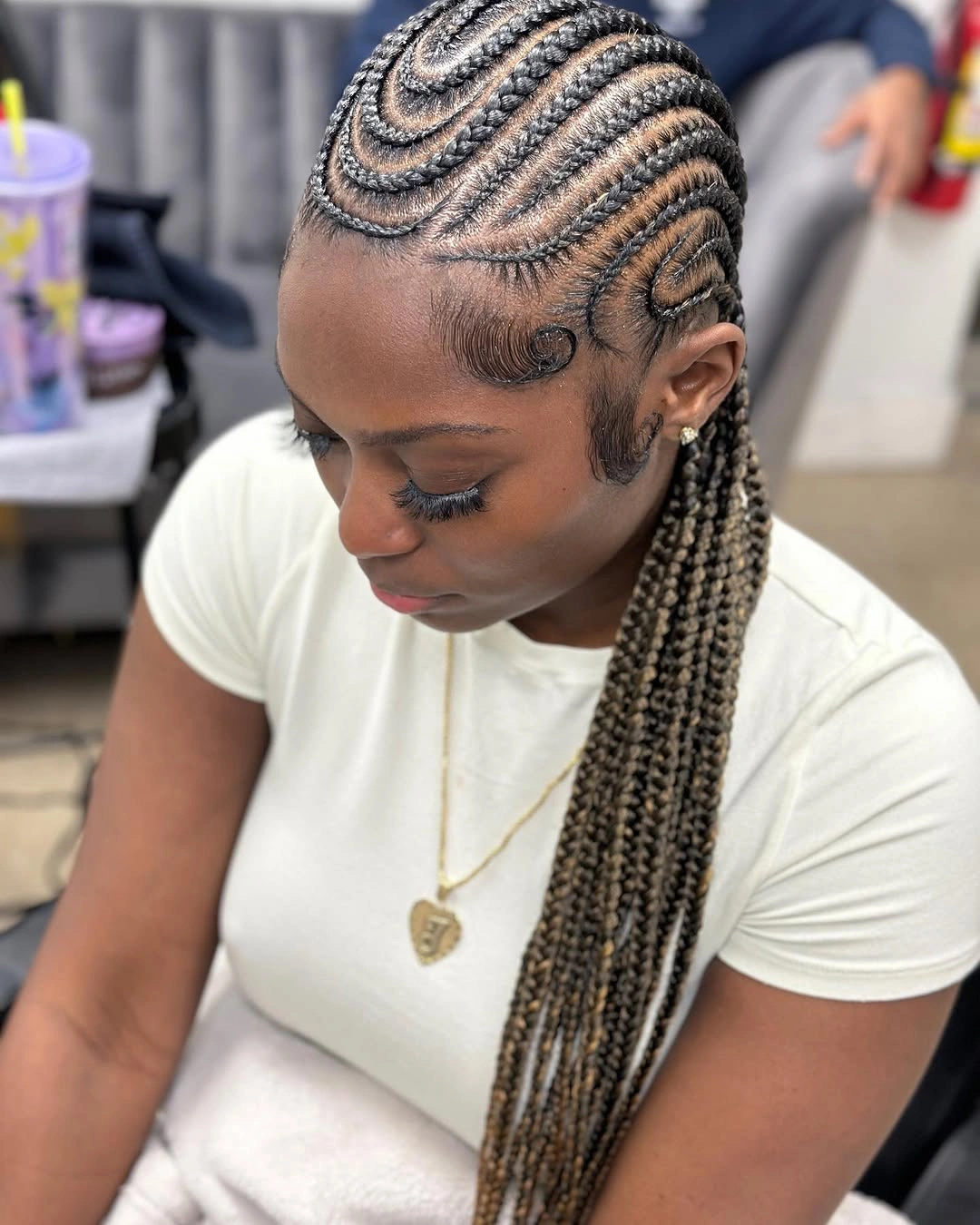 feed in braid hairstyles Swirling Feed-In Cornrows With Long Blonde Ends