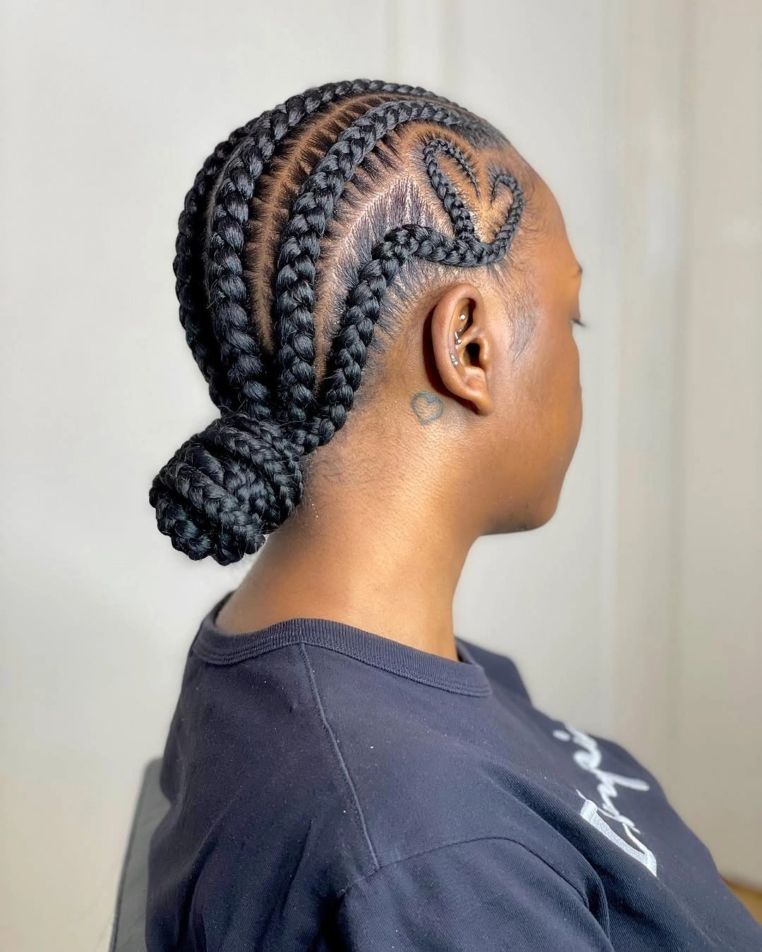 feed in braid hairstyles Elegant Low Braided Bun With a Heart Detail