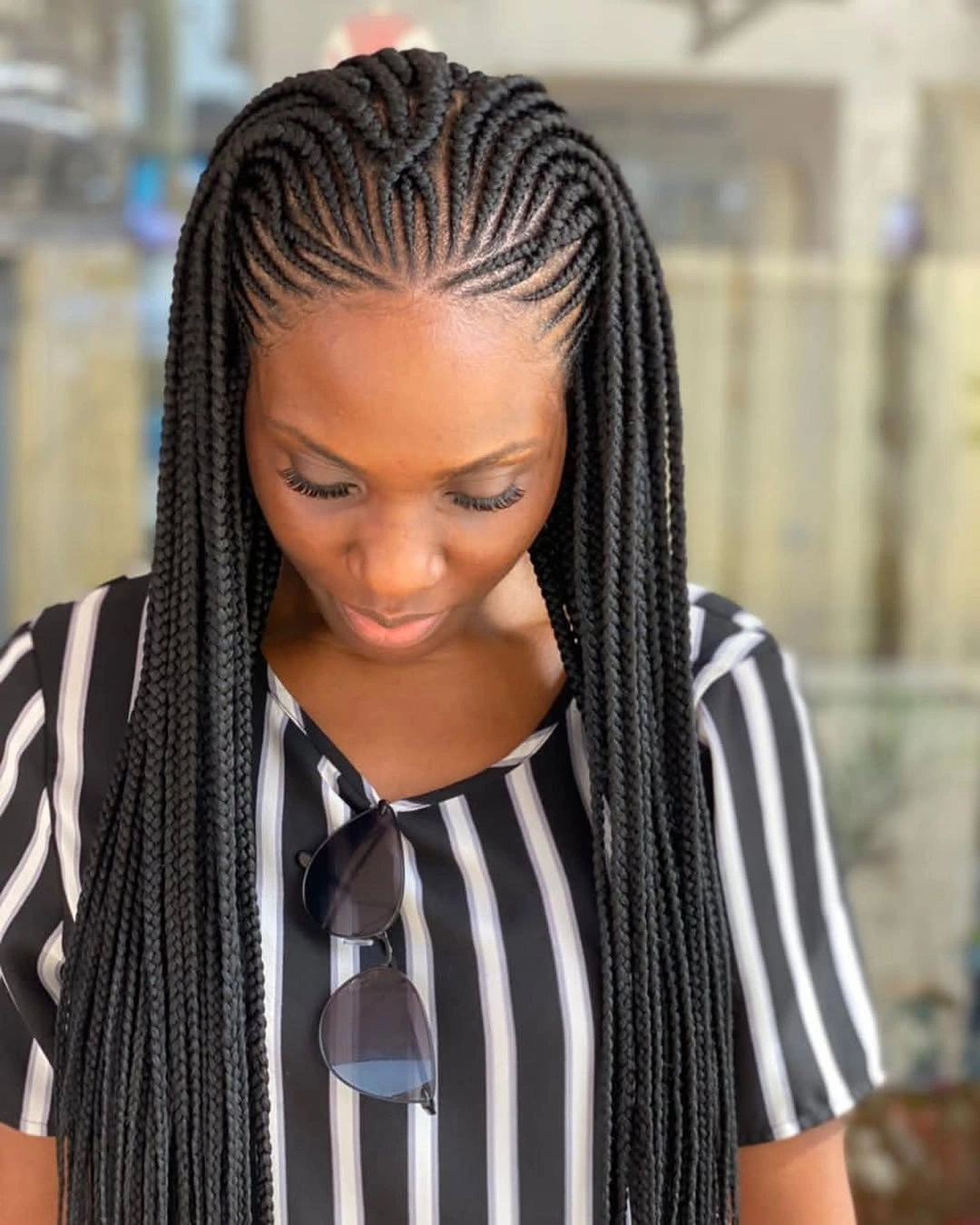 feed in braid hairstyles Long Side-Swept Feed-In Braids With Sculpted Cornrows