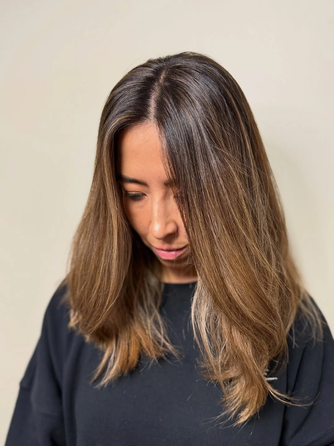 full head babylights blonde on brown hair Soft Beige Babylights With a Modern Collarbone Cut