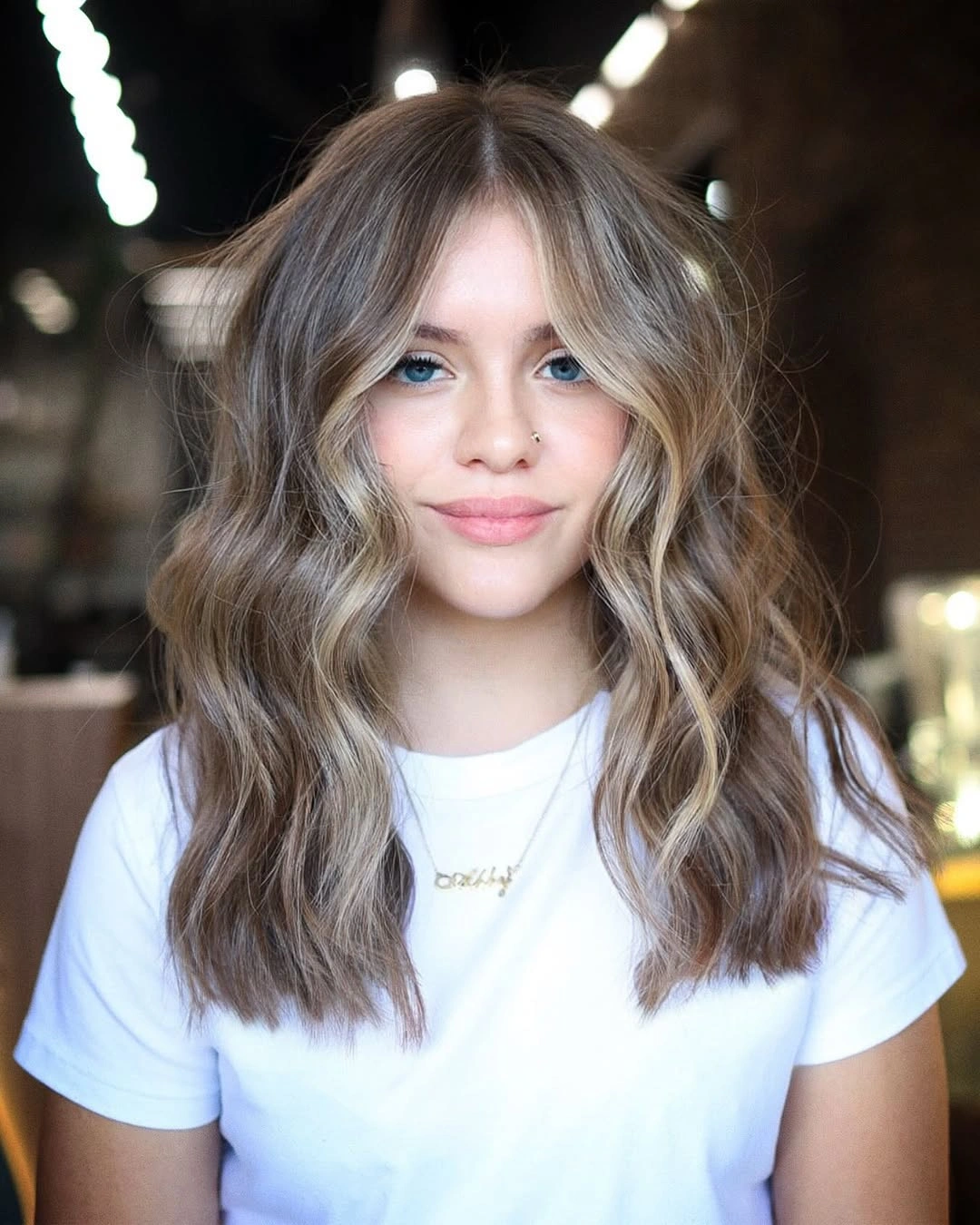 full head babylights blonde on brown hair Soft Face-Framing Blonde With Textured Medium Length