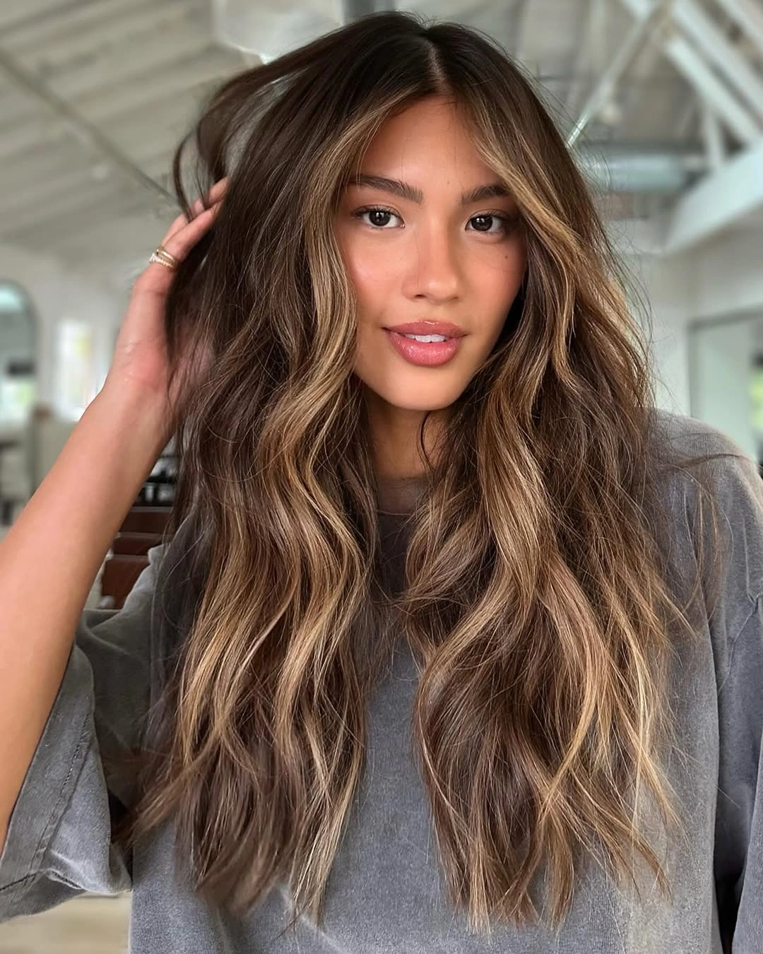 full head babylights blonde on brown hair Face-Framing Babylights That Brighten Every Brunette