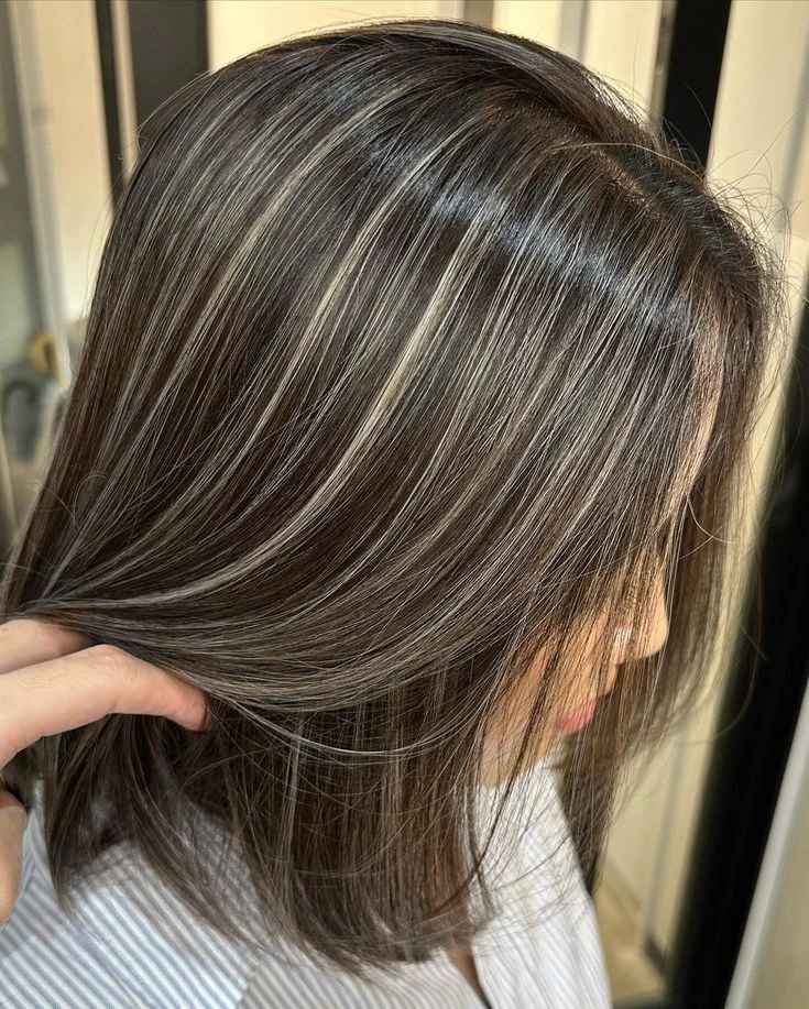 full head babylights blonde on brown hair Silky Straight Babylights for a Chic Lob