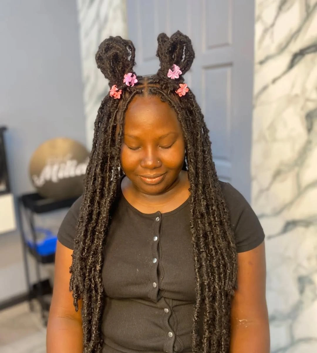 locs hairstyles for black women Playful Double Buns with Long Soft Locs