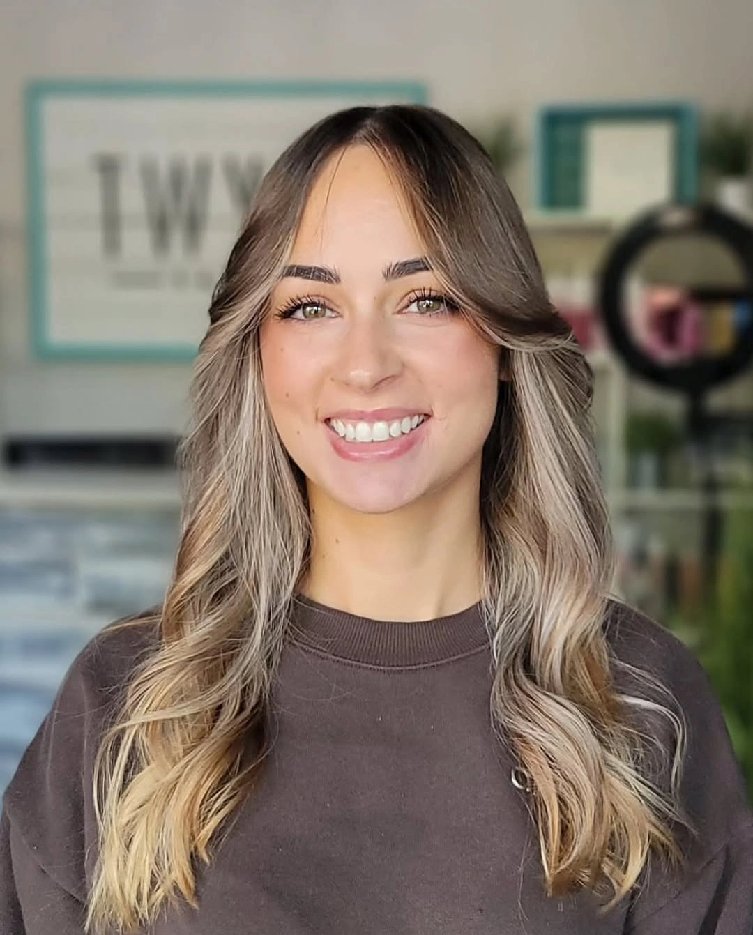 September hairstyles ideas 2026 Soft Balayage Waves With Curtain Fringe