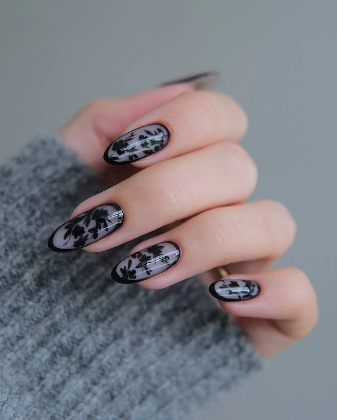 September nail art ideas 2026 Black Sheer Nails With Pale Floral Panels