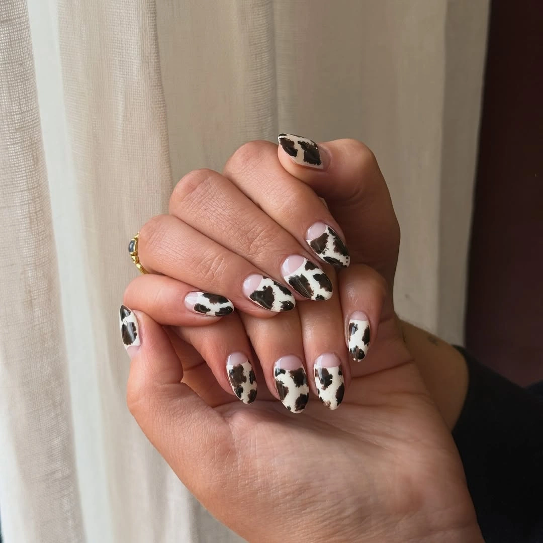 September nail art ideas 2026 Cow Print Short Nails With Black And White Contrast