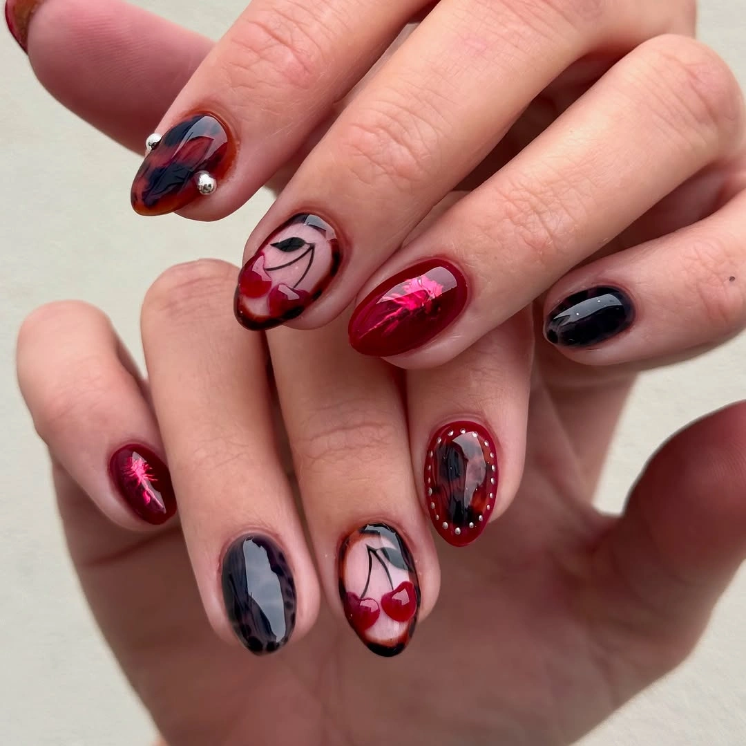 September nail art ideas 2026 Red And Black Graphic Nails With Glossy Depth