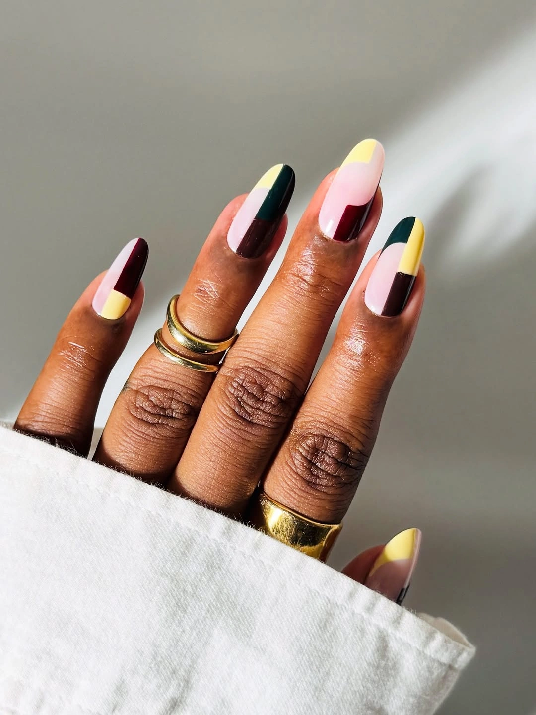 September nail art ideas 2026 Black And Yellow Almond Nails With Graphic French Blocks