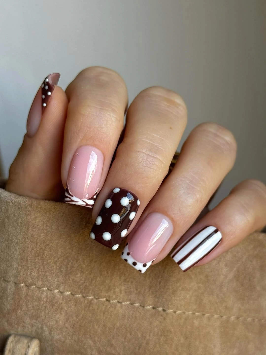 September nail art ideas 2026 Brown Dot And Stripe Nails On Soft Pink Base