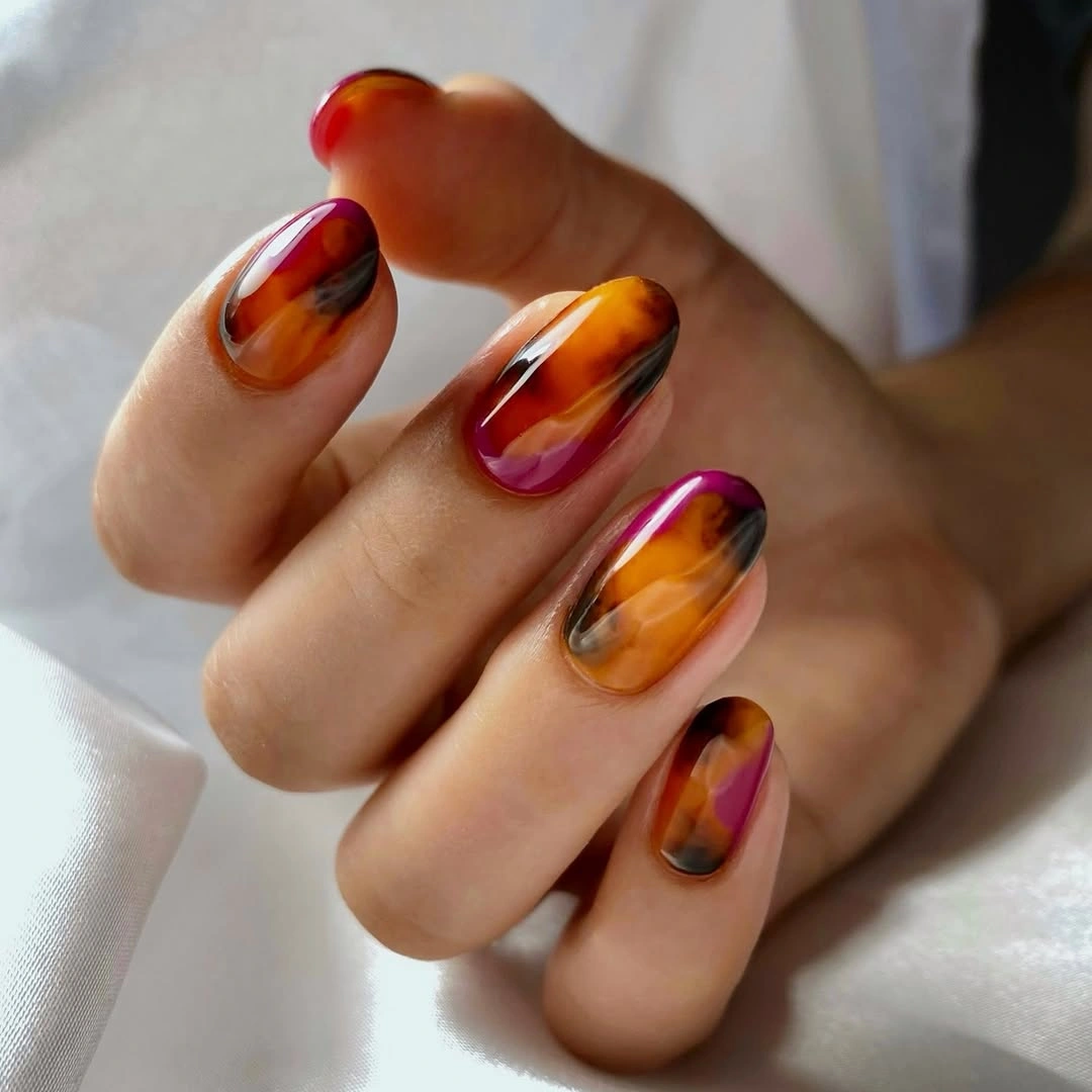 September nail art ideas 2026 Amber Swirl Nails With Warm Marbled Movement