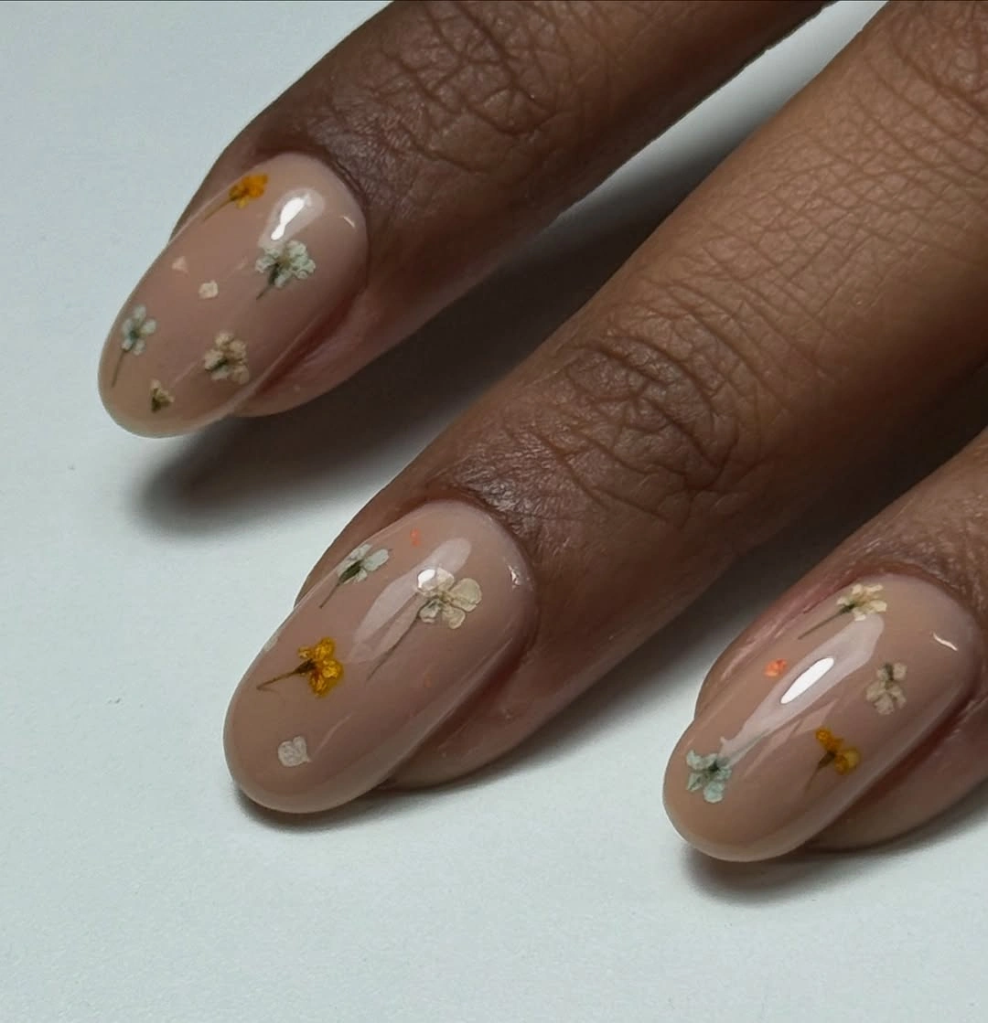 September nail designs 2026 Tiny Floral Nude Nails With Soft Rounded Tips