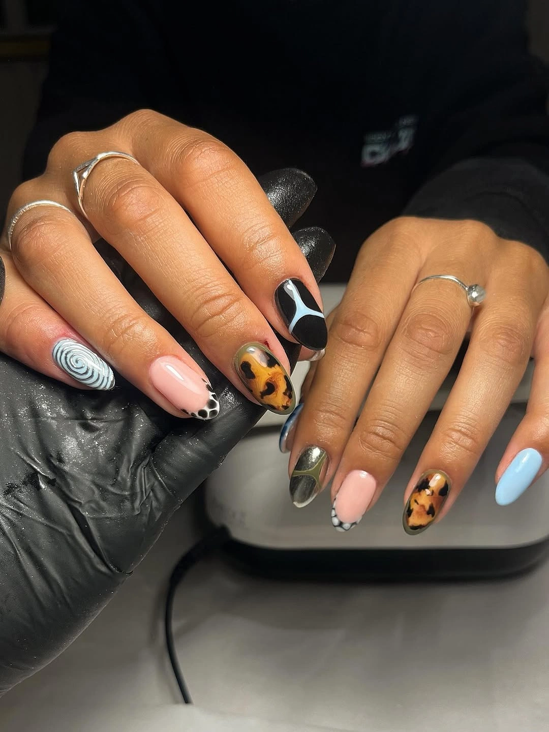 September nail designs 2026 Mismatched Almond Nails With Tortoise And Blue Detail