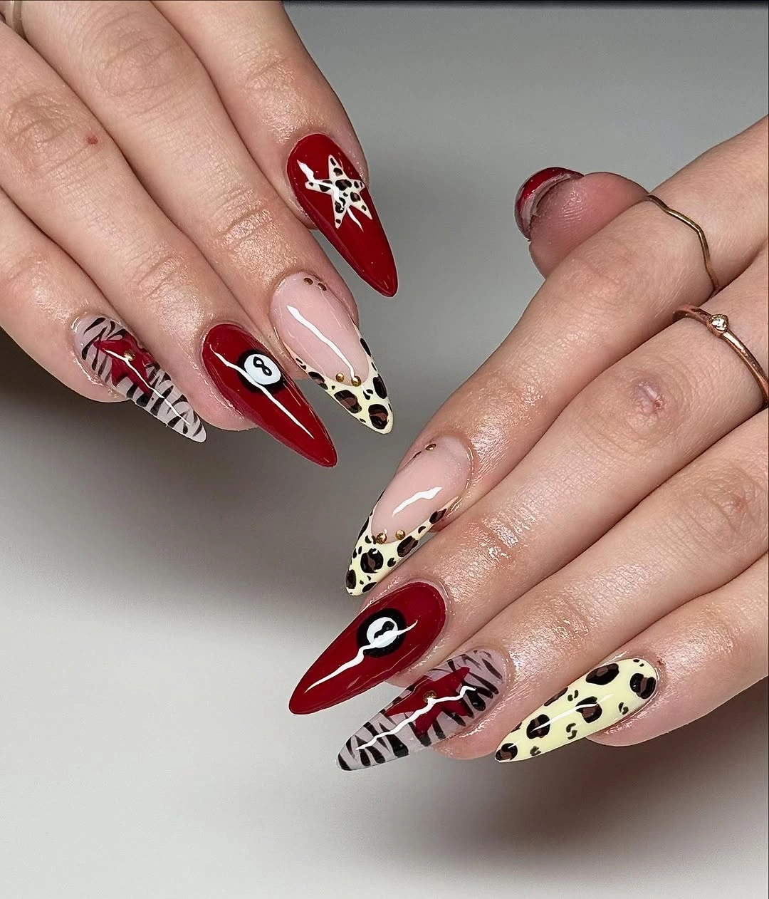 September nail designs 2026 Red Almond Nails With Animal Print Accent Mix