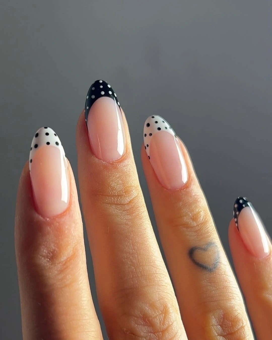 September nail designs 2026 Black Dotted French Tips On Sheer Almond Nails