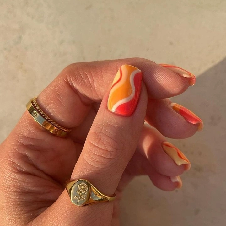 September nails color 2026 Orange Wave Nails With Soft Nude Space