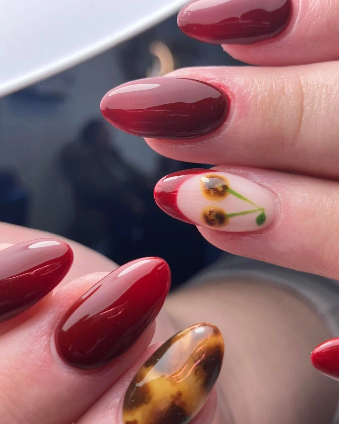 September nails color 2026 Wine Red Almond Nails With Tortoise Floral Accent