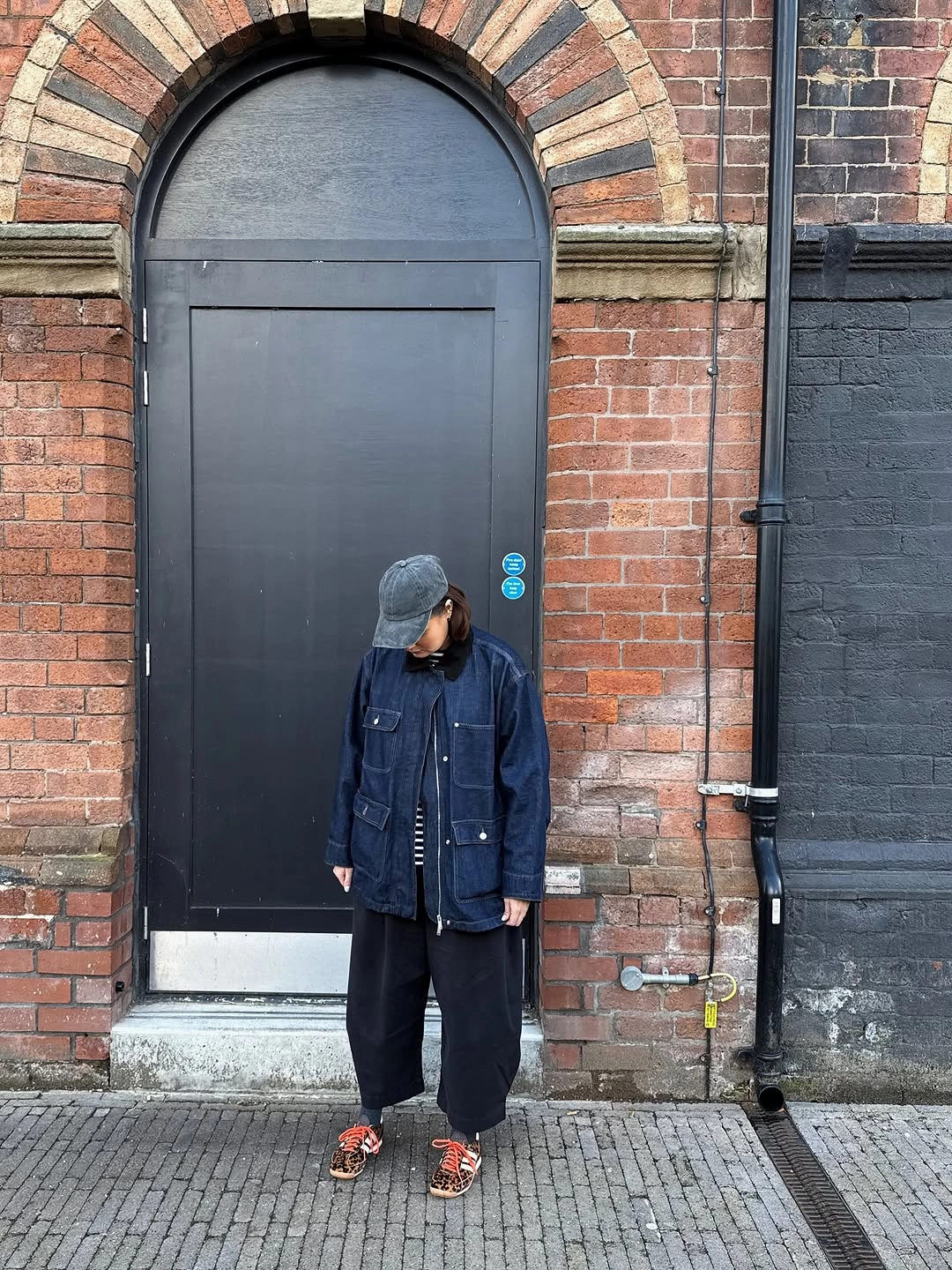 September outfits ideas 2026 Navy Rain Jacket With Relaxed Black Layers