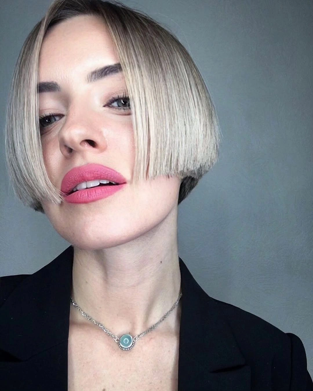 short bobbed hairstyle Sharp Center-Part Bob with Glass-Like Precision