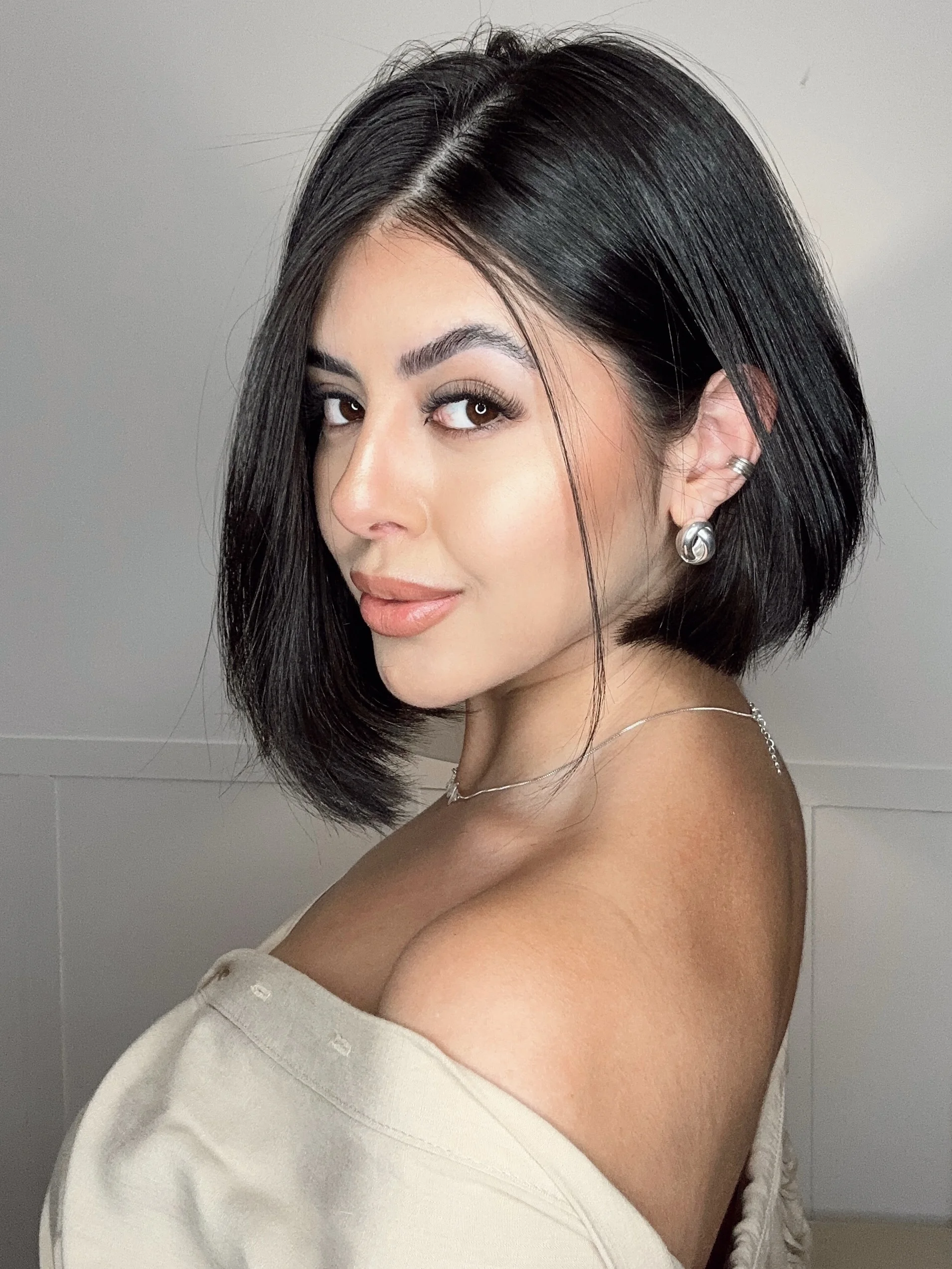 short bobbed hairstyle Classic Precision Bob with a Deep Side Part