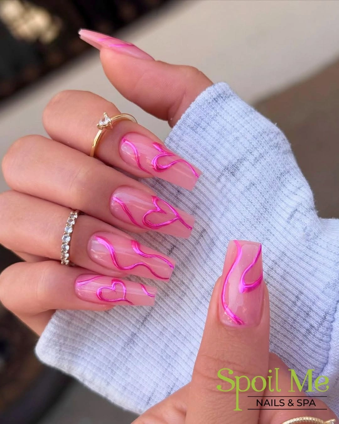 Long almond sheer nails with neon pink outline art