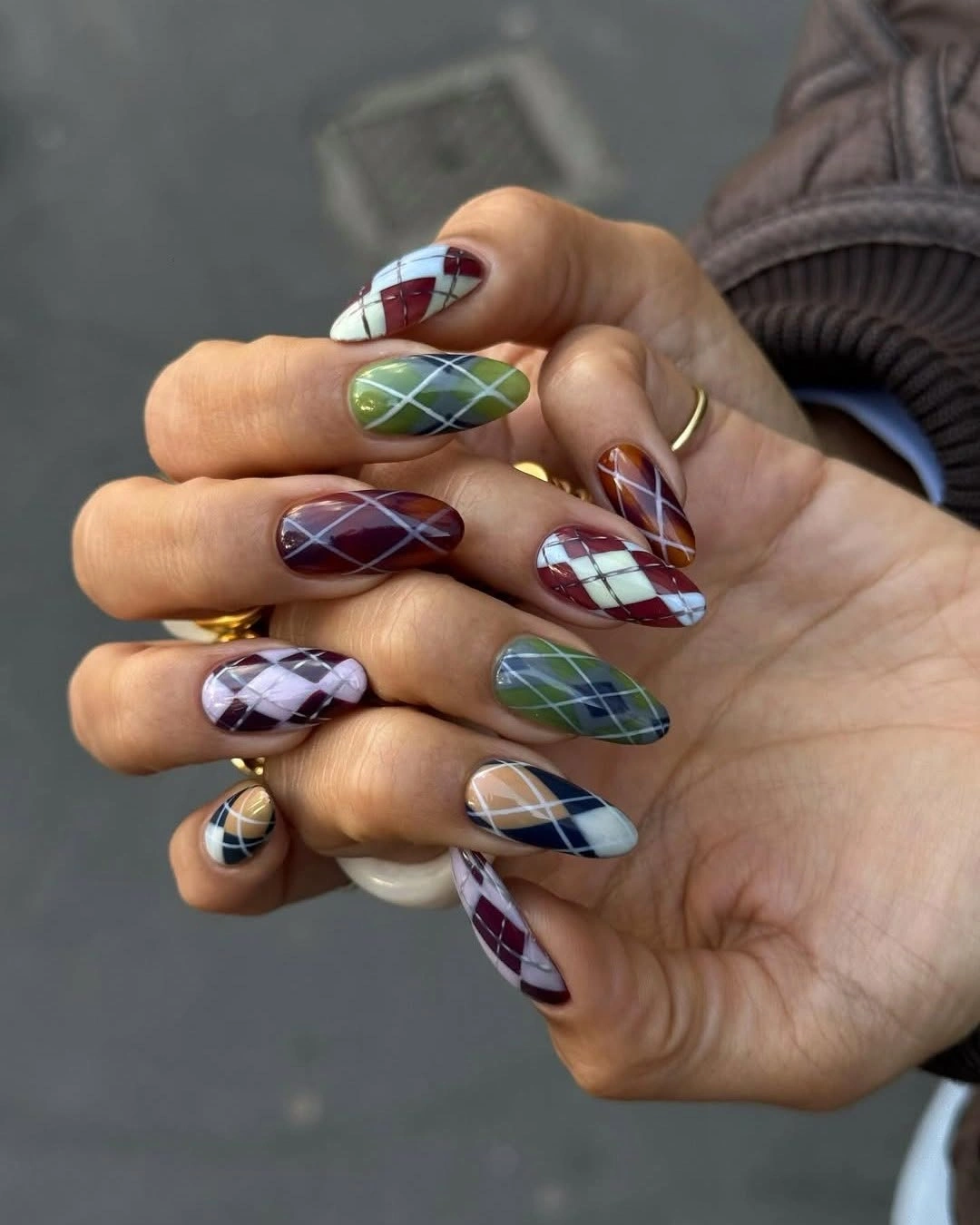 Long almond jewel tone plaid autumn nails with mixed accents
