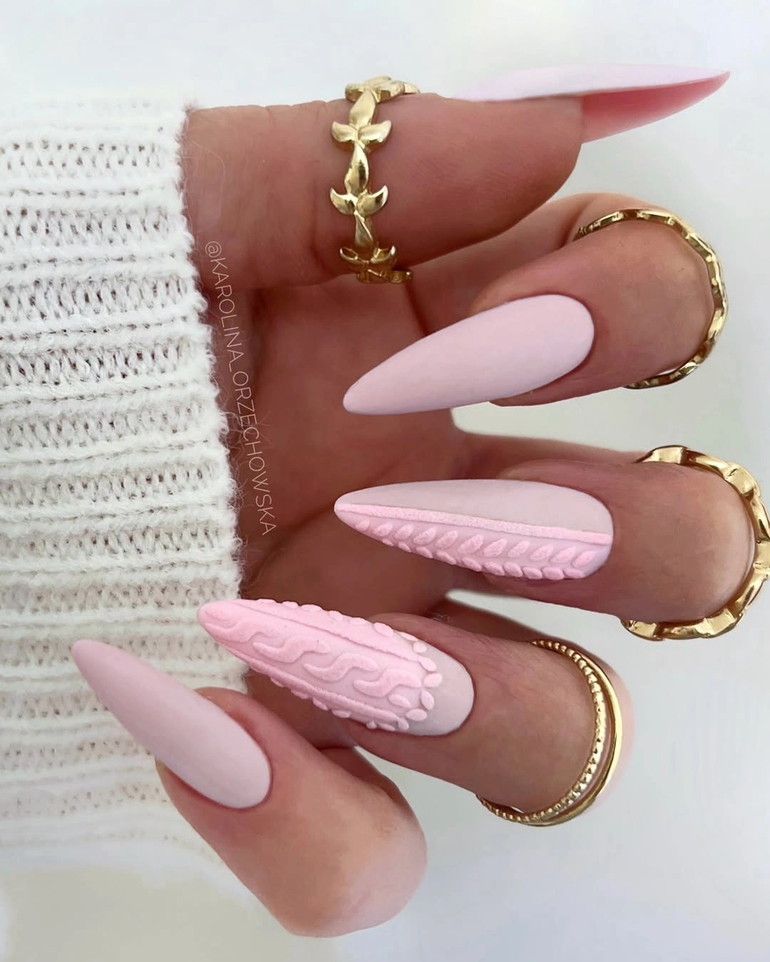 Long almond pale pink autumn nails with textured gold accents