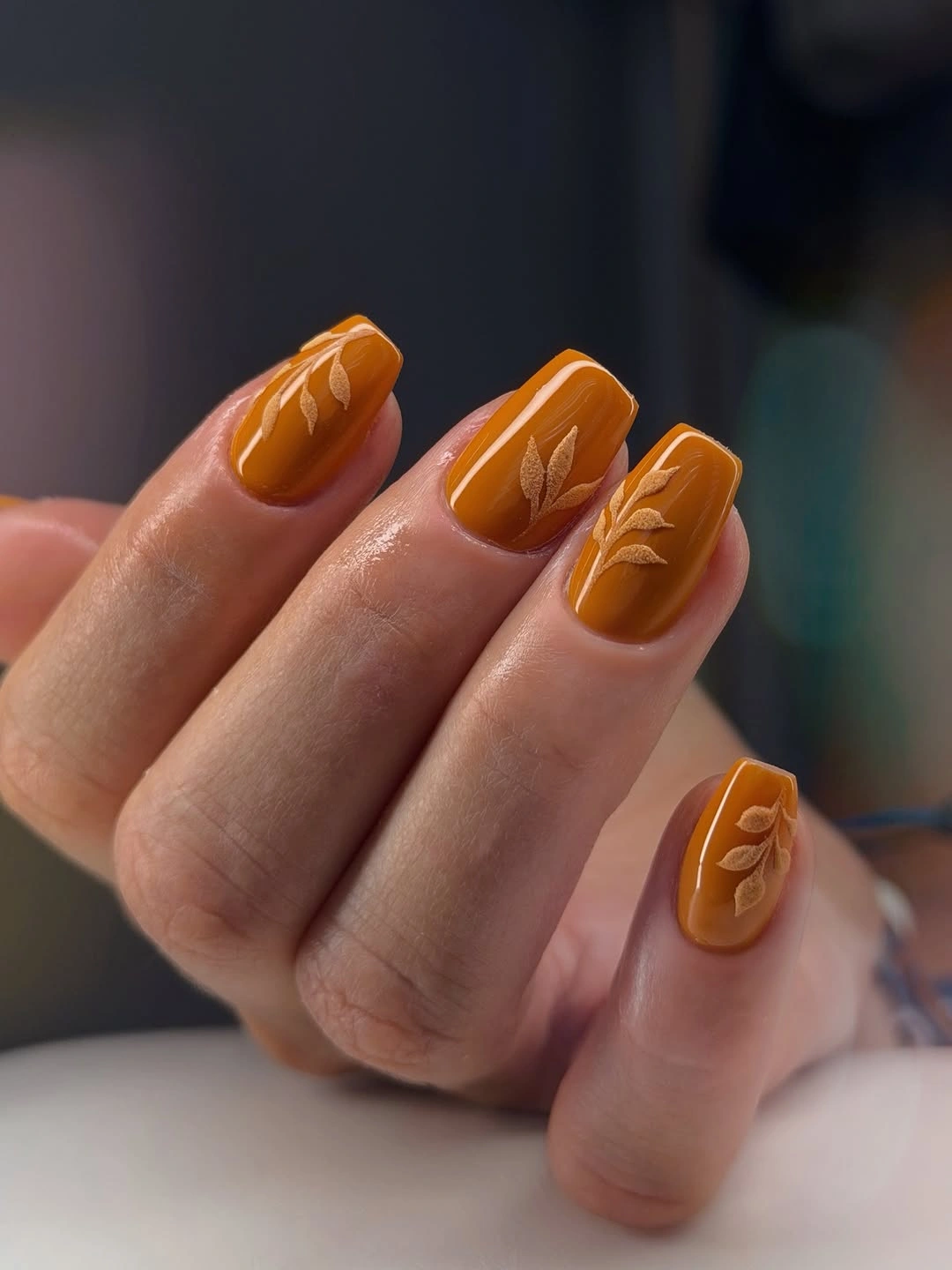 Medium square orange textured autumn nails with tonal lines