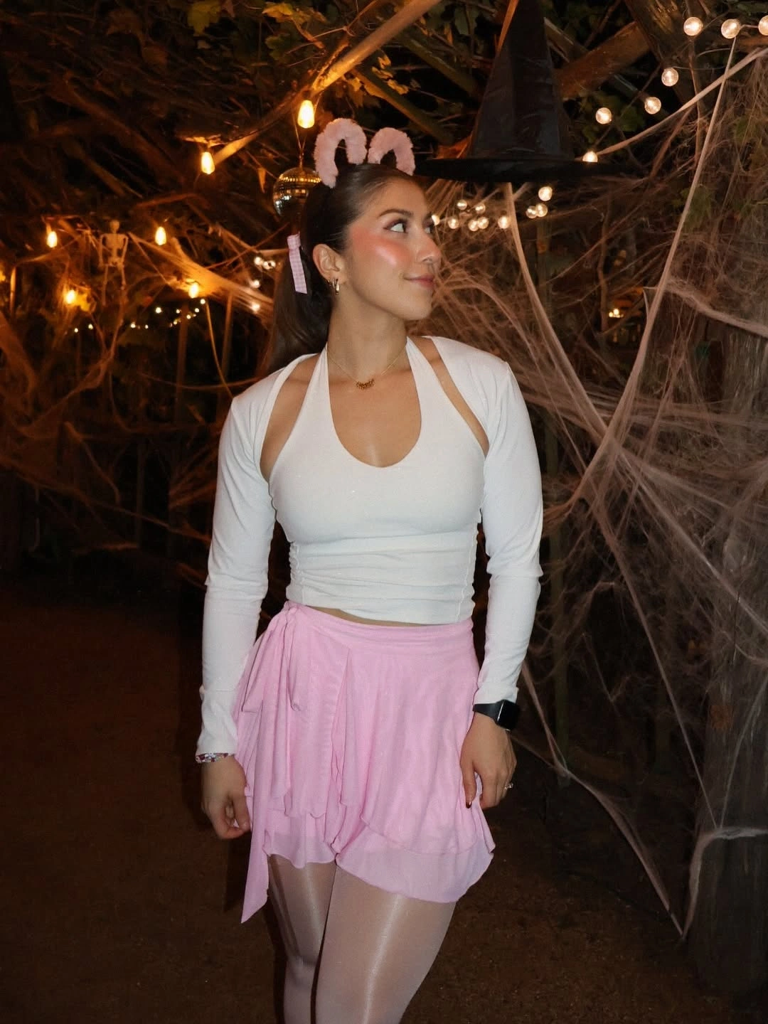 Pink tulle skirt costume with white shrug cropped top and black mouse ears