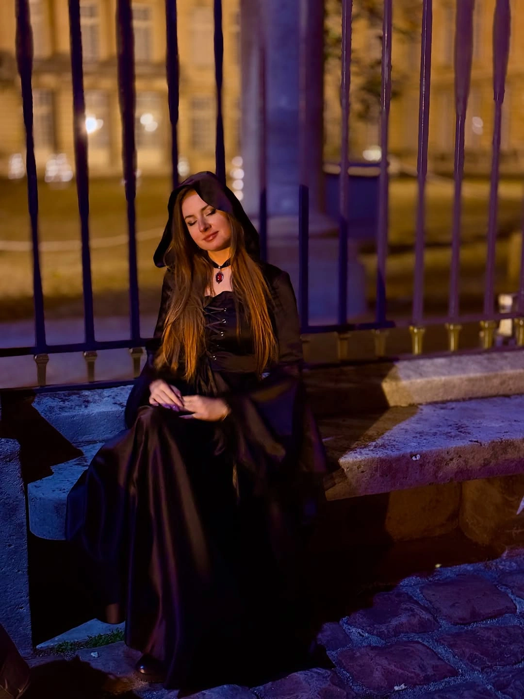 Dark witch costume with pointed hat long black dress and dramatic evening silhouette