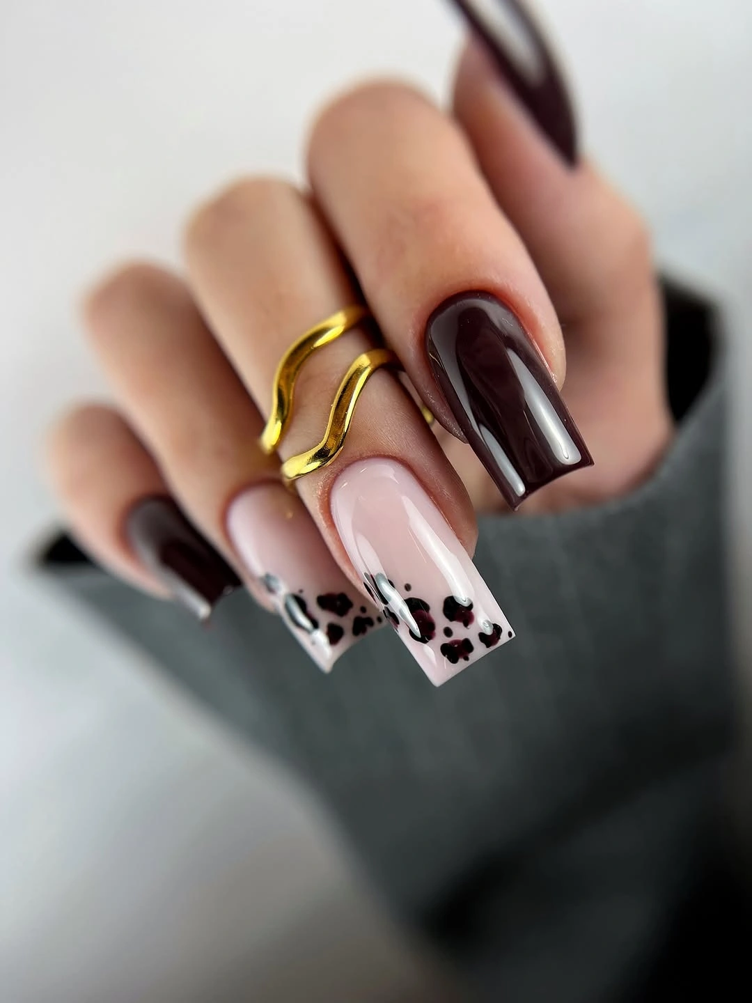 Long square espresso nails with pale patterned black and white tips