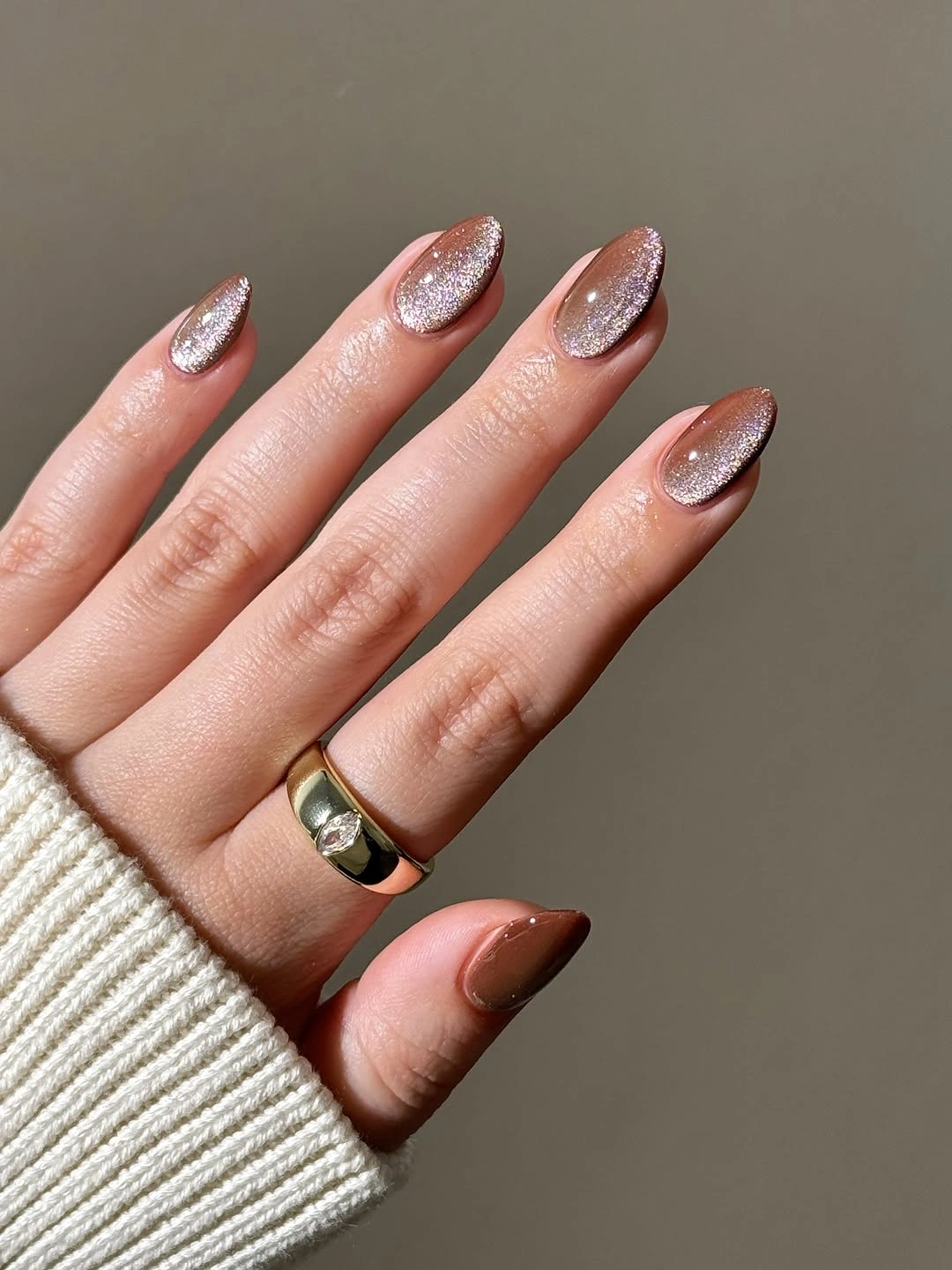 Medium almond mauve brown nails with a soft reflective finish