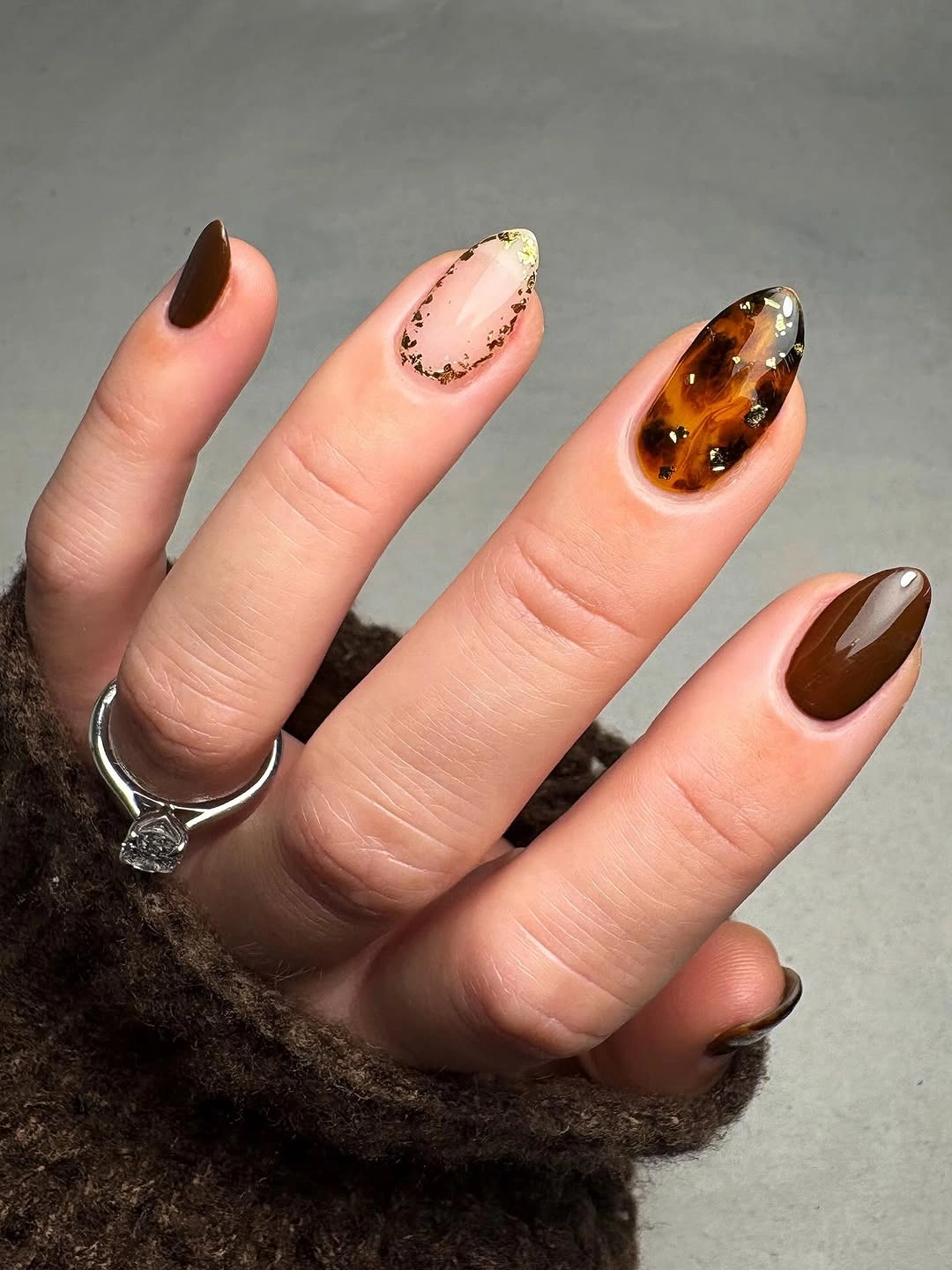 Medium almond nails in layered warm brown caramel and chocolate tones