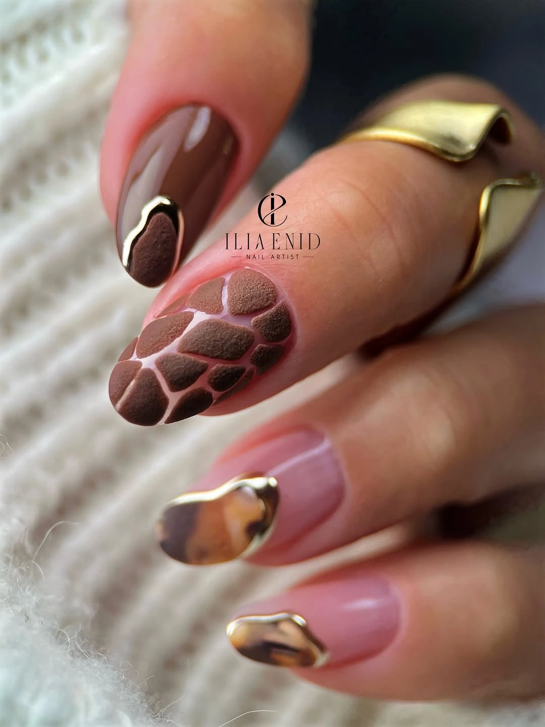 pink almond nails with brown spotted and mauve accents
