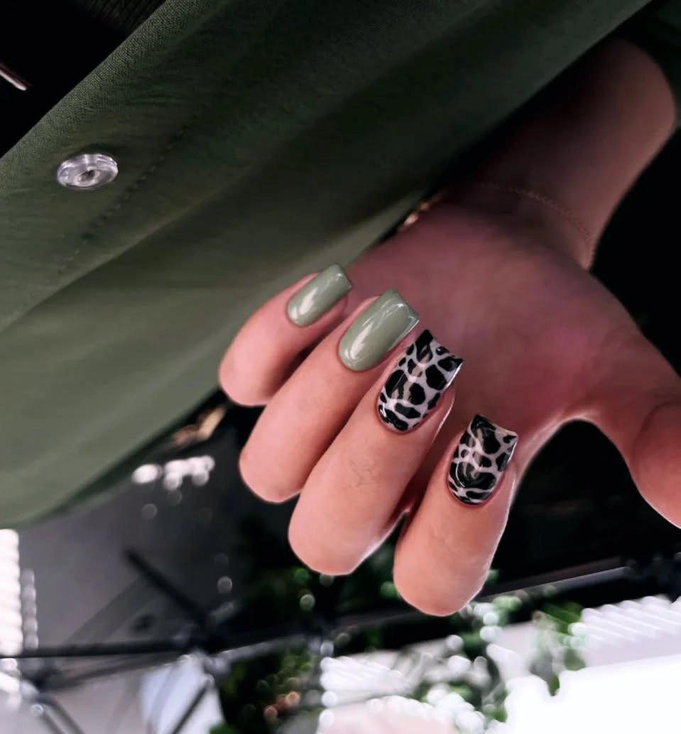 Muted sage square nails with black abstract accents