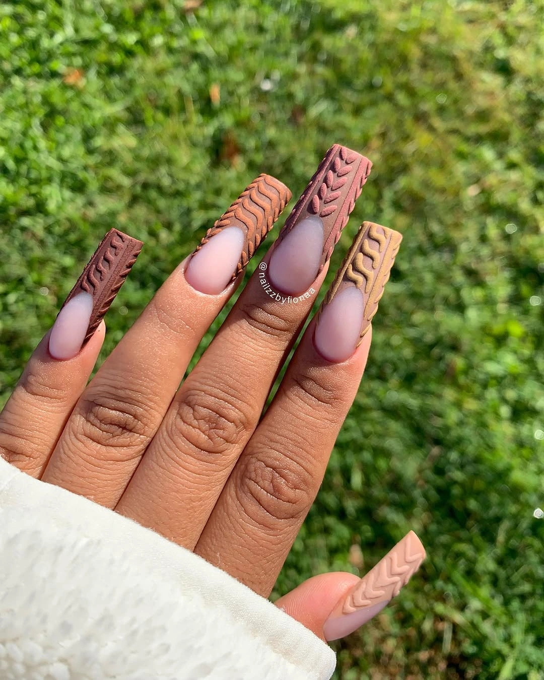 Warm textured tip nails with nude centers