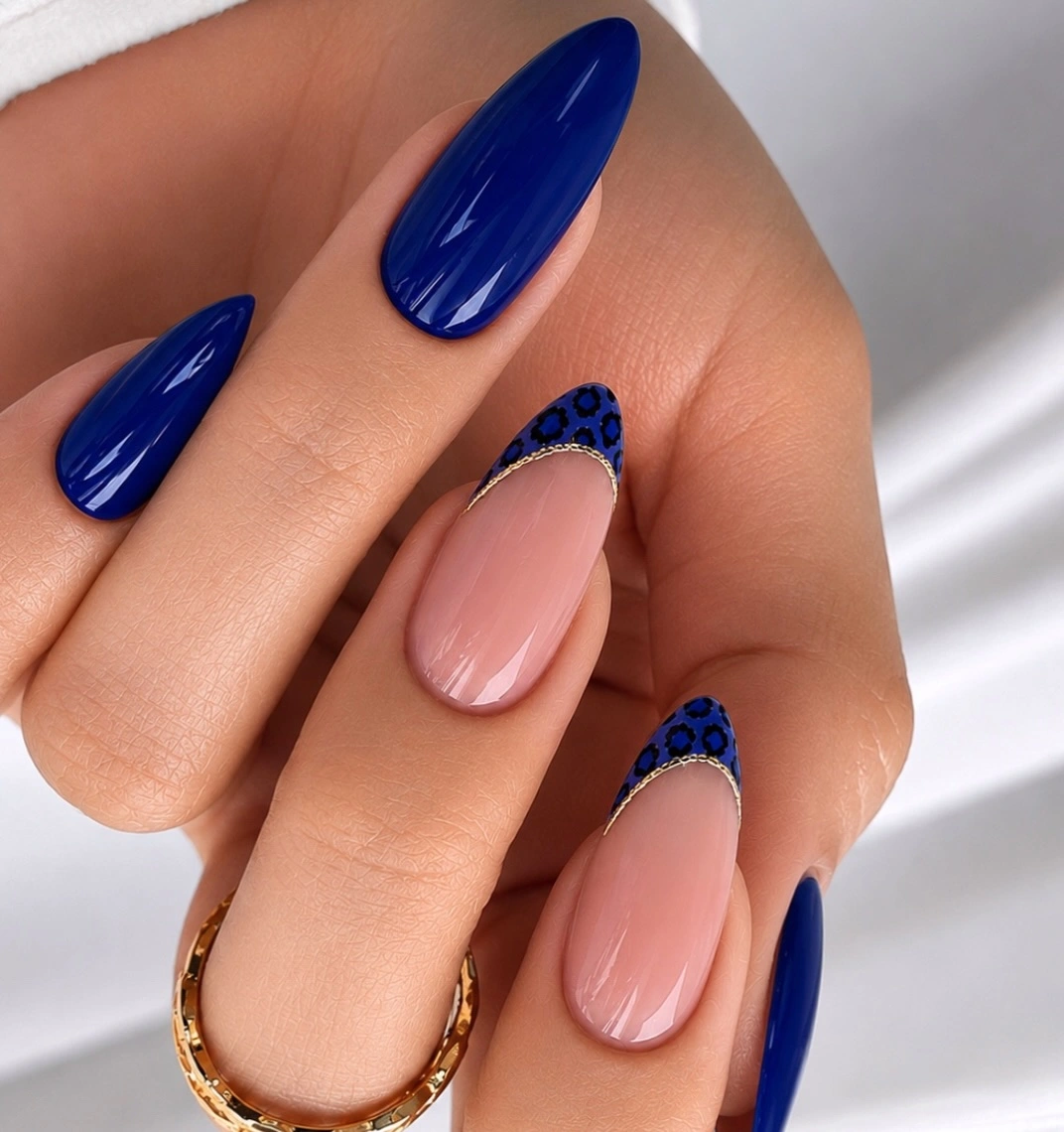 Cobalt almond nails with leopard French accent tips
