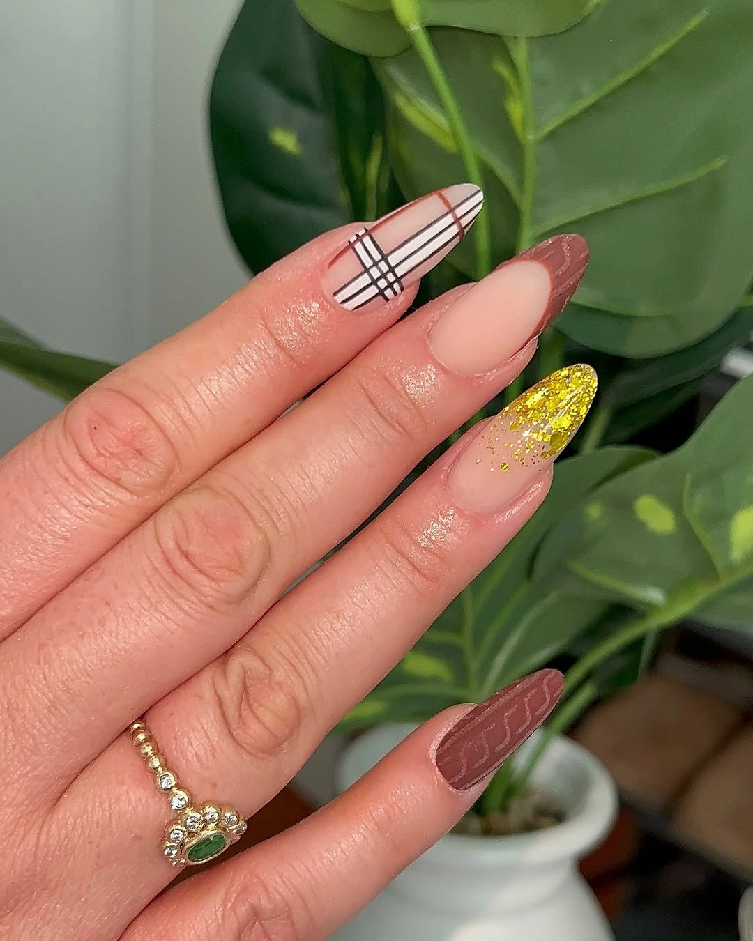 Almond nails with plaid brown texture and yellow glitter