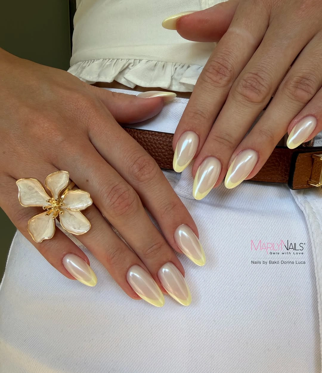 Pearly nude almond nails with pale yellow tips