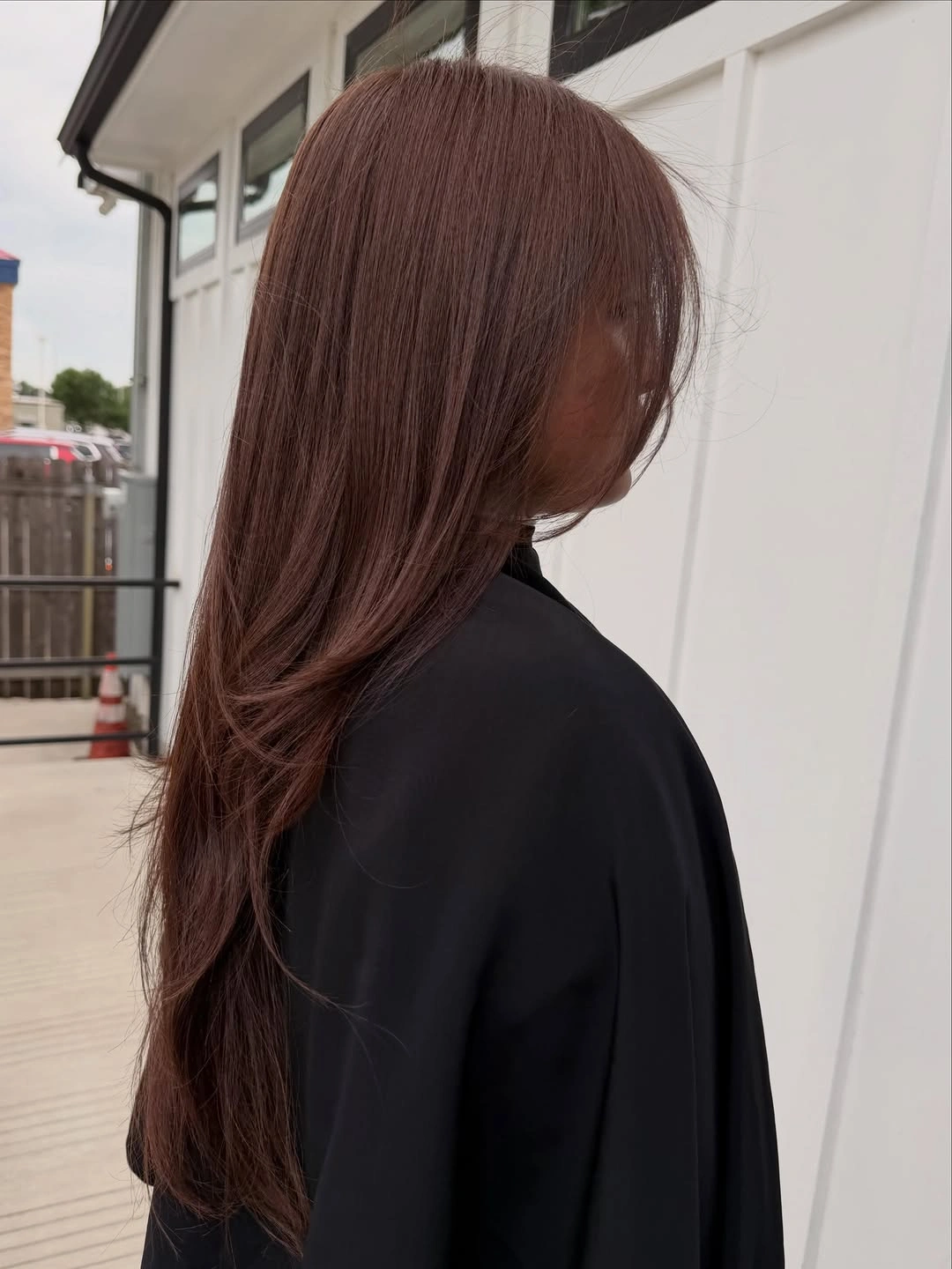 Dark auburn brown hair with smooth softly layered lengths