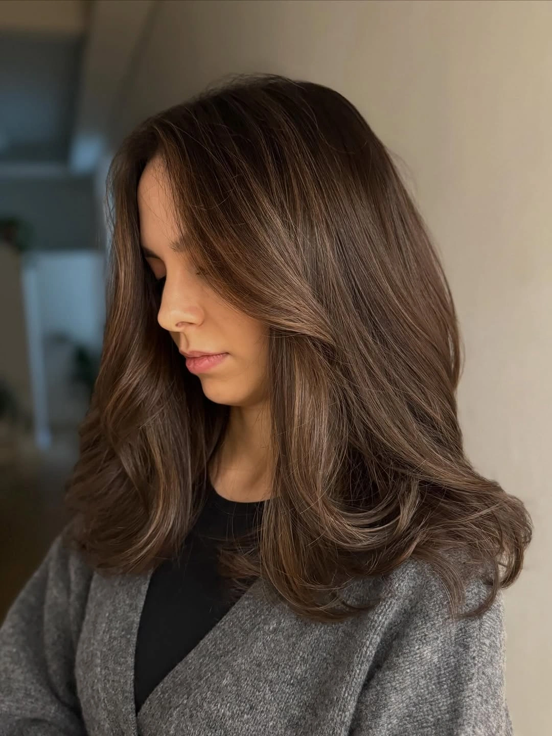 Soft chocolate waves with curtain bangs and rounded ends