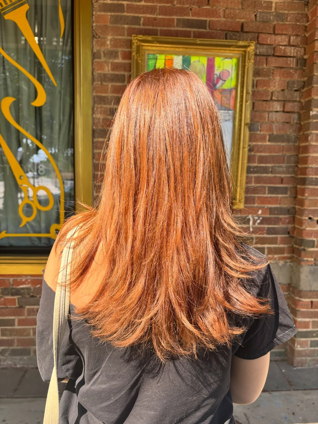 Warm copper auburn hair with softly waved ends