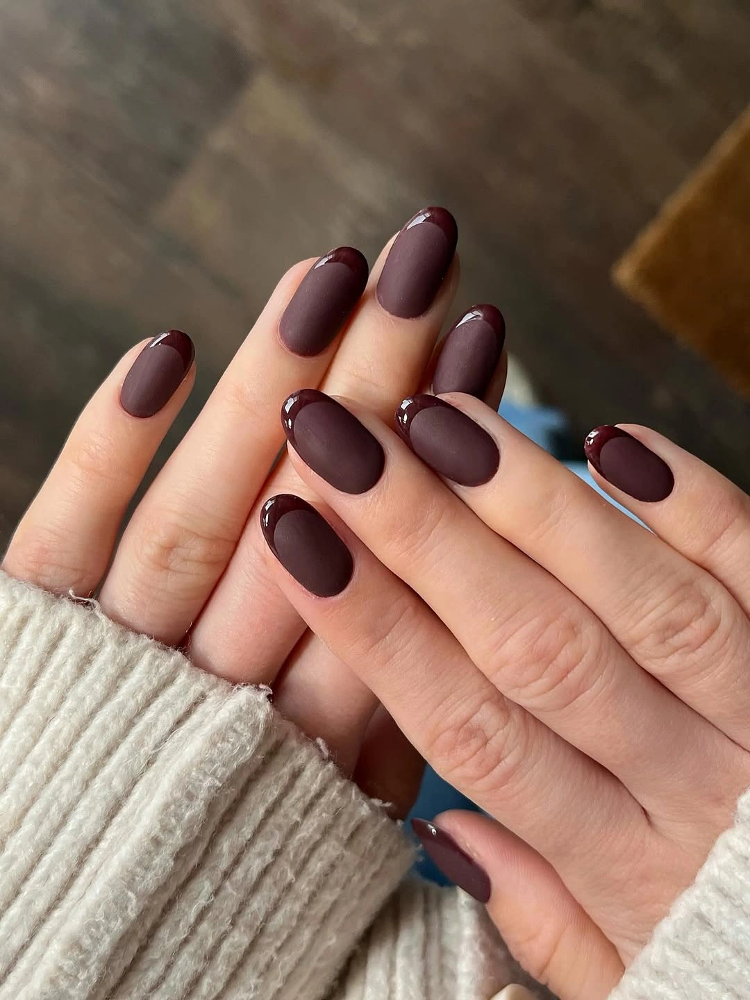Short rounded nails in matte plum burgundy